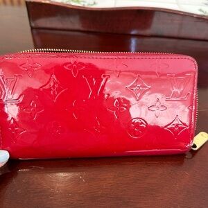 Red patent leather Louis Vuitton Wallet.  Preowned. With dust bag and box.